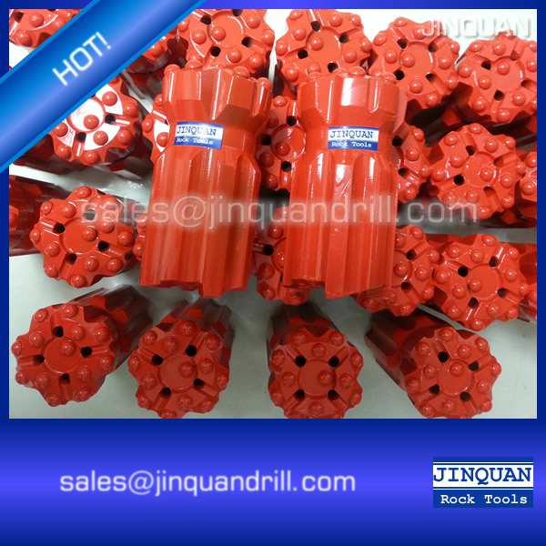 Top hammer rock drilling tools