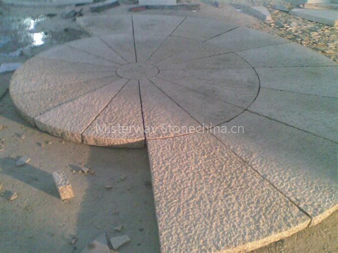 rusty yellow granite paving circle