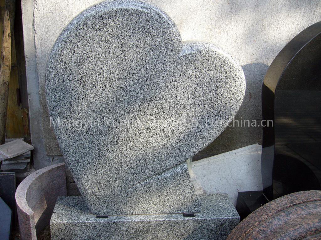 Grey granite tombstone