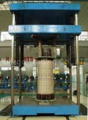 Transformer coil trueing (reshaping) machine